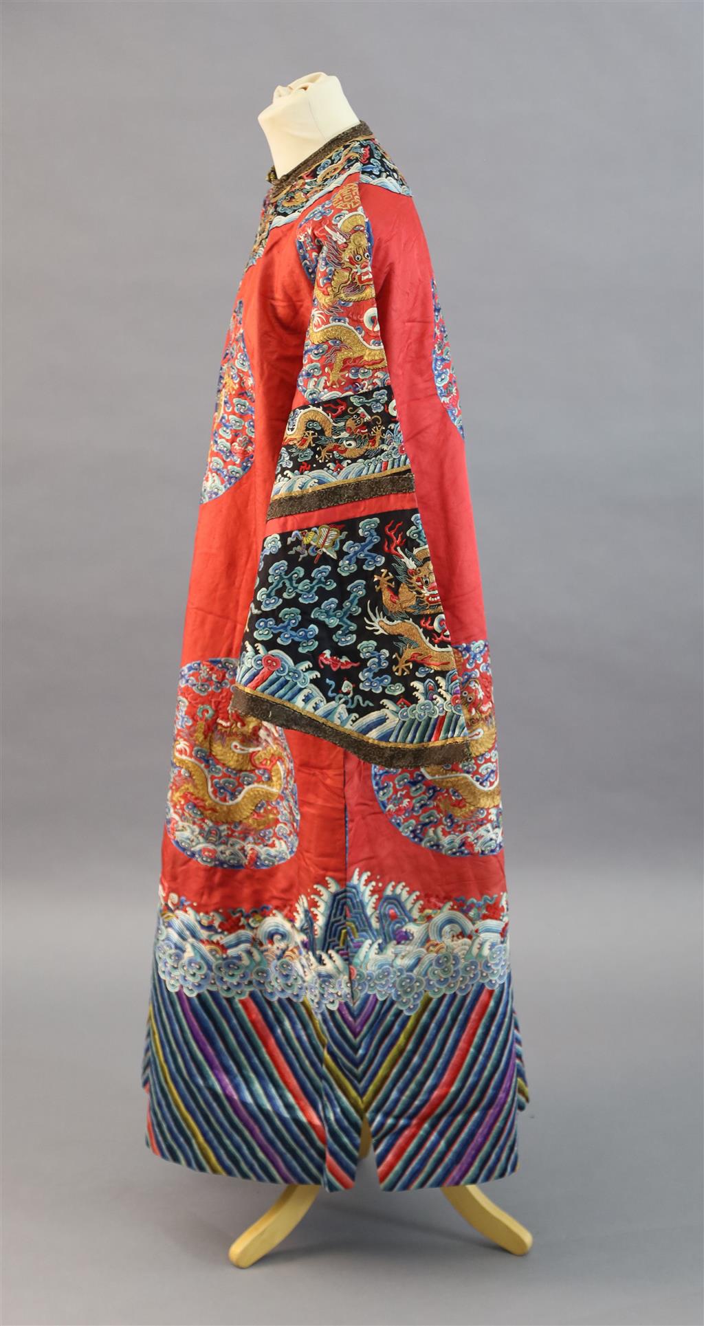 A Chinese red satin dragon winter robe, late Qing dynasty, length 129cm